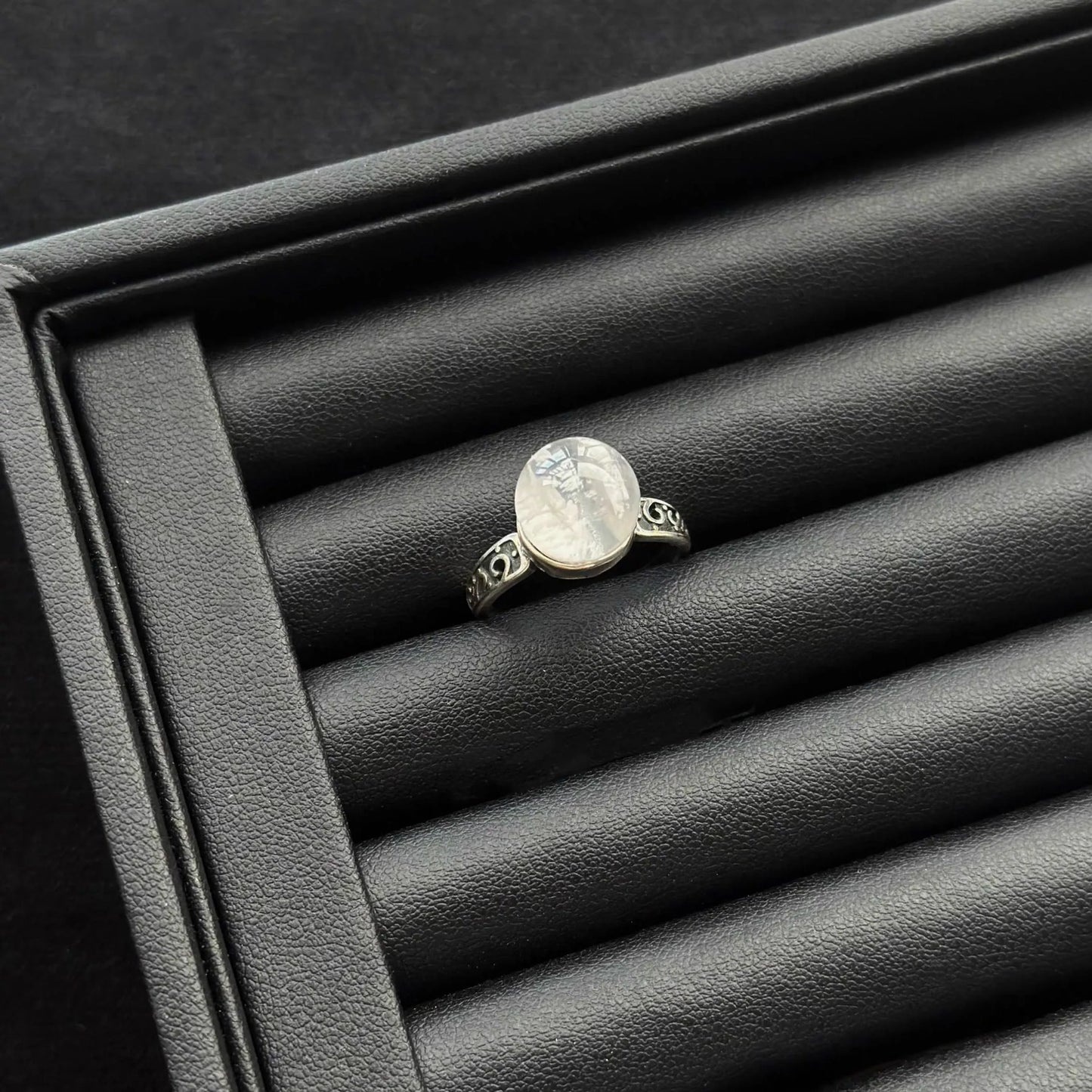Snow Phantom Quartz Sterling Silver Ring in a black jewelry box