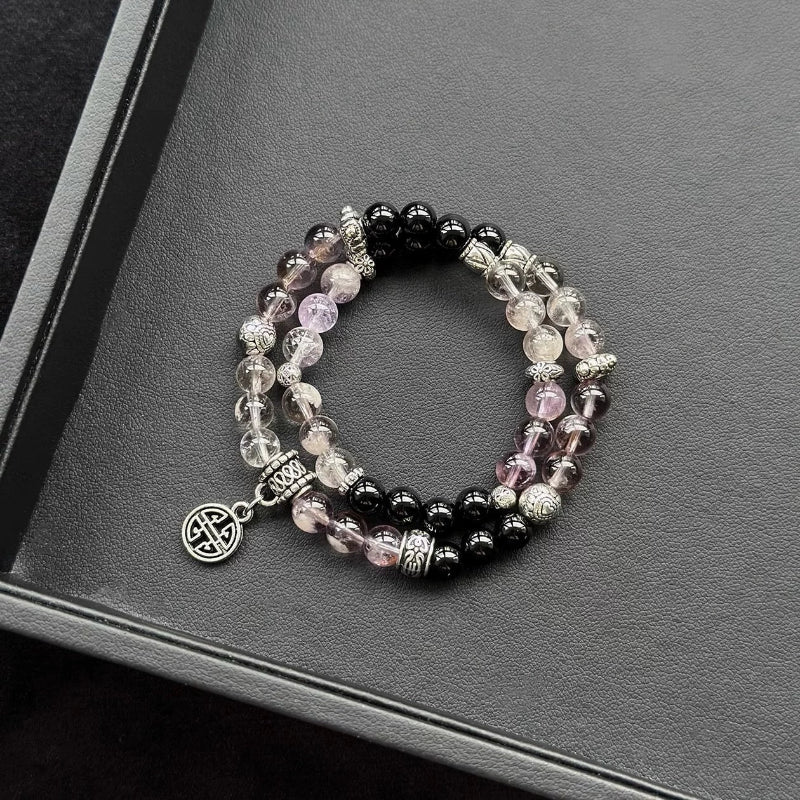 Healing crystal bracelet featuring Amethyst Phantom and Black Agate – supports intuition, emotional balance, and spiritual grounding.