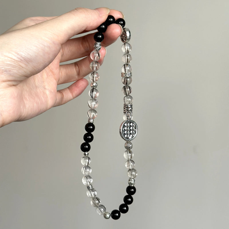Beaded bracelet made with Frost Rutilated Quartz and Black Agate – ideal for strength, inner calm, and energy balance.