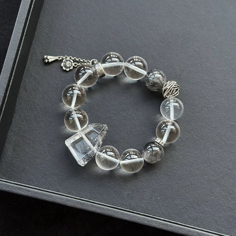 Healing crystal bracelet featuring Black Rutilated Quartz and Clear Quartz – supports clarity, protection, and energy purification.