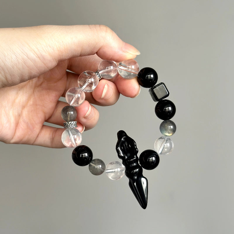 Crystal healing bracelet with Black Rutilated Quartz, Obsidian, and Milky White Quartz – promotes grounding, strength, and emotional stability.