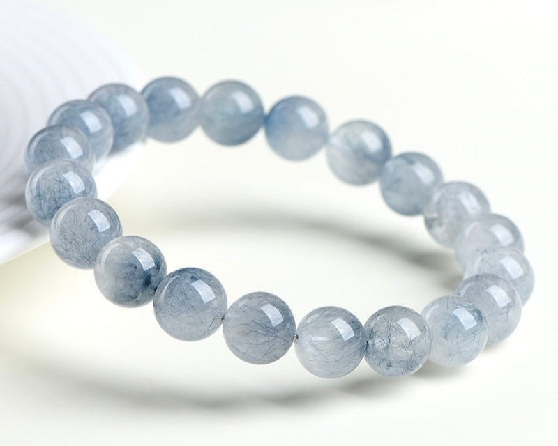 Bracelet with crystal beads – light blue rabbit hair quartz for clarity and peace
