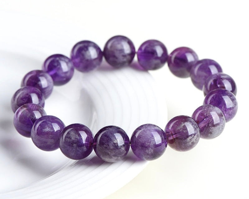 Feather Amethyst crystal bracelet aligning third eye and crown chakras for insight