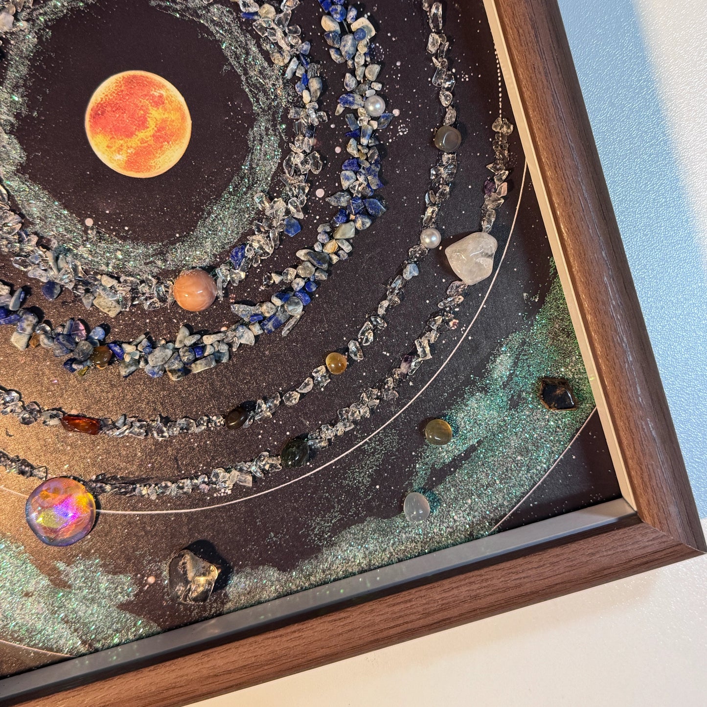 Close-up of the emerald green glitter nebula and crystal planets in the Galaxy Art.