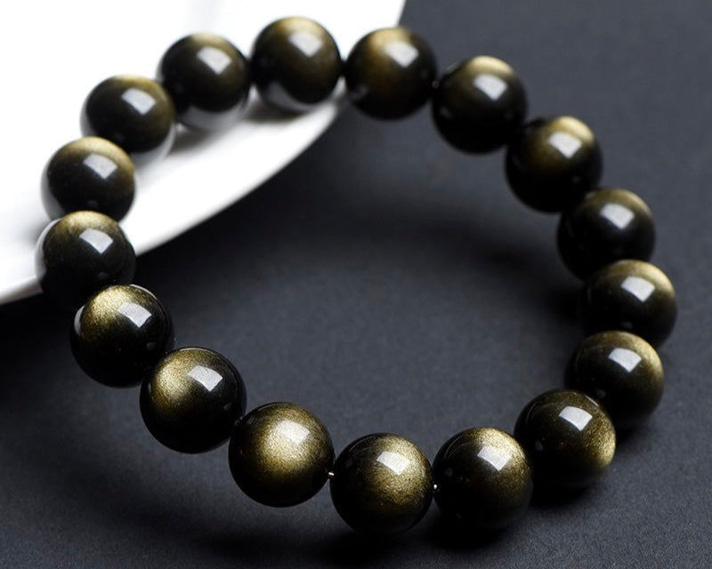 Gold Obsidian crystal bracelet promoting grounding, calm, and protection