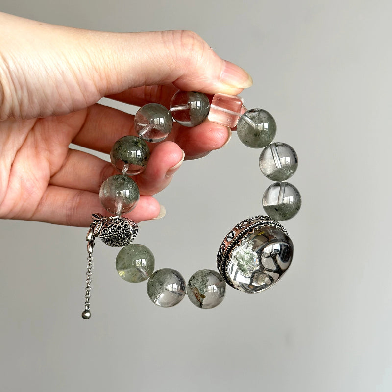 Crystal healing bracelet made with Green Phantom Quartz and Clear Quartz – promotes emotional renewal, calm, and inner balance.