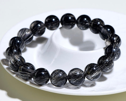 Healing energy bracelet made with Black Rutilated Quartz – crystal jewelry for anxiety, overthinking, and focus