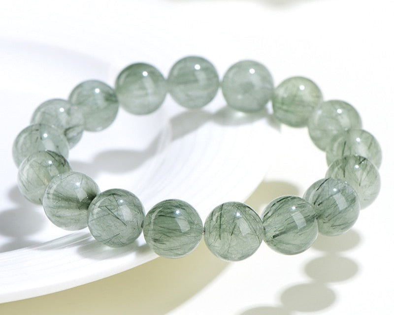Healing crystal bracelet made of light green rutilated quartz – for focus and calm