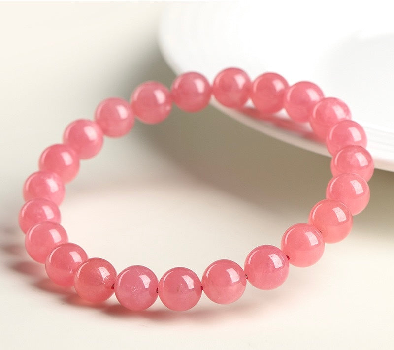 High quality rhodonite bracelet for compassion and emotional release, crafted with natural gemstones by Aura Verse.