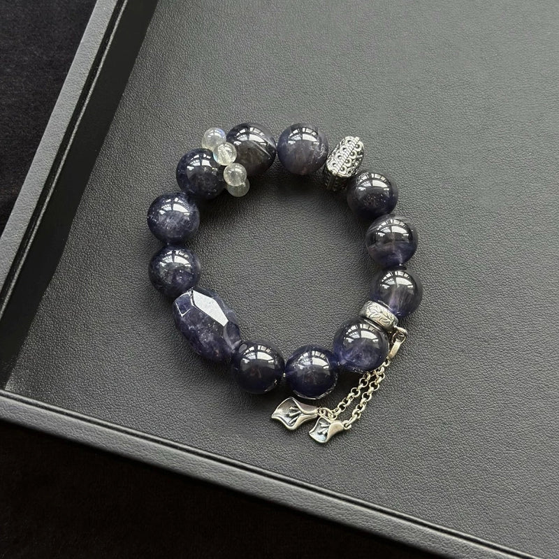 Healing crystal bracelet featuring Iolite and Grey Moonstone – supports intuition, emotional balance, and inner clarity.