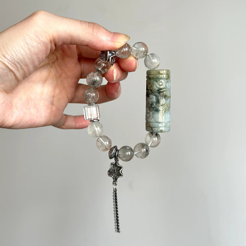 Crystal healing bracelet with Rabbit Hair Quartz and Jade – promotes calm energy, balance, and inner strength.