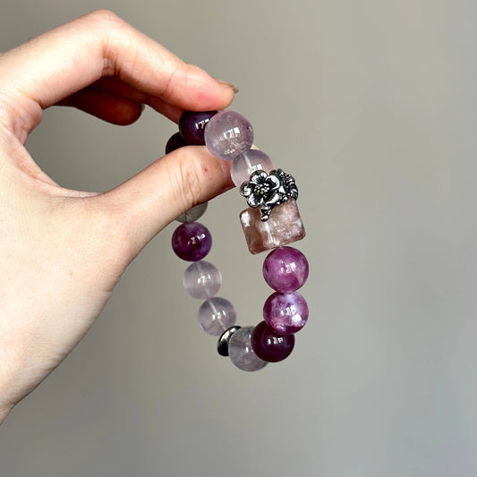 Crystal healing bracelet featuring Lepidolite and Amethyst – designed to ease stress and support heart and crown chakra alignment.