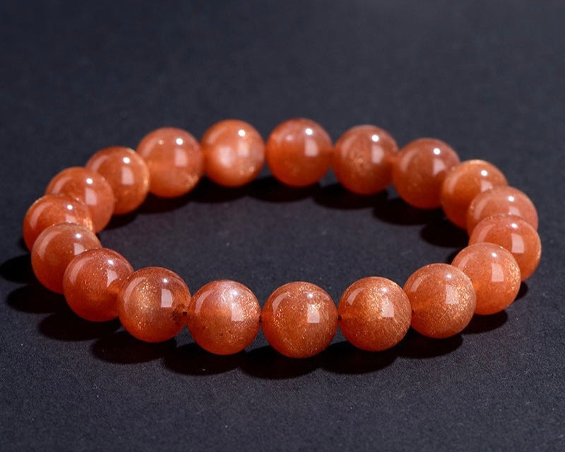 Side view of Orange Moonstone Bracelet with soft peach crystal beads