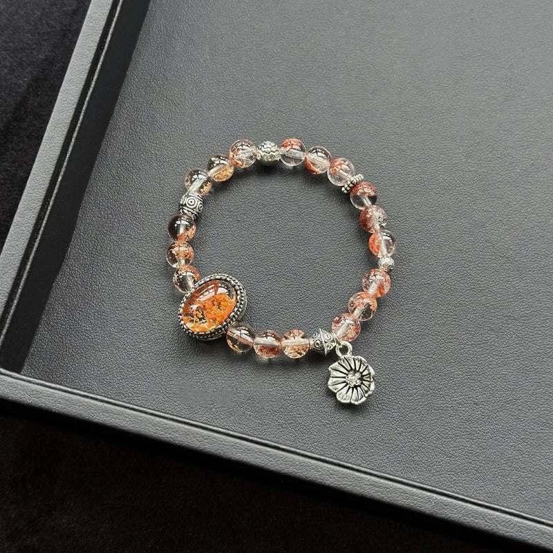 Healing crystal bracelet featuring Orange Phantom Quartz – supports creativity, emotional healing, and energy revitalization.