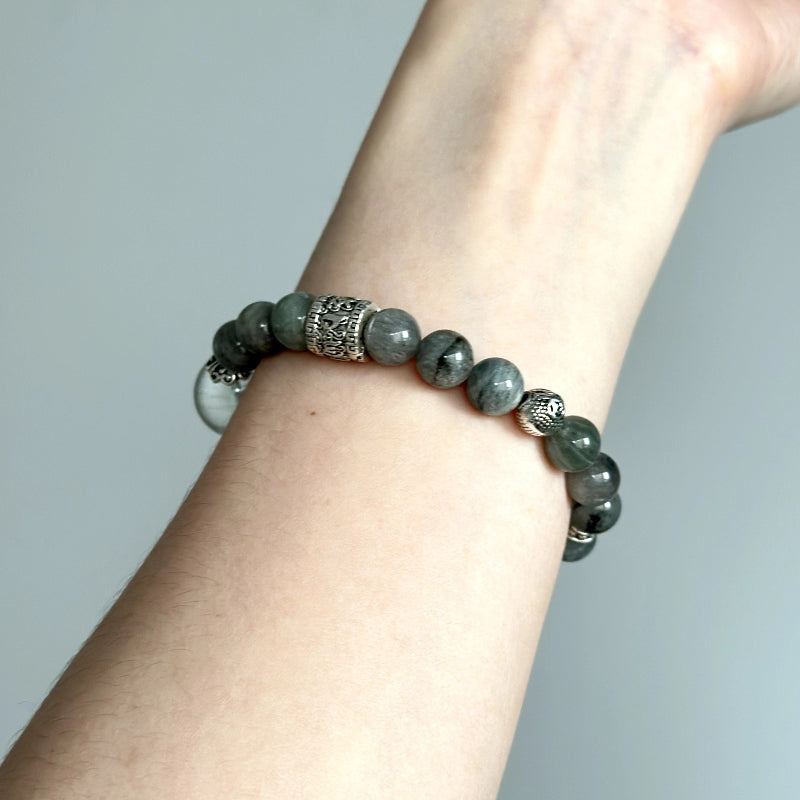 Elegant beaded bracelet with Green & Blue-Grey Rabbit Hair Phantom Quartz – handmade crystal jewelry for peace and energy alignment.