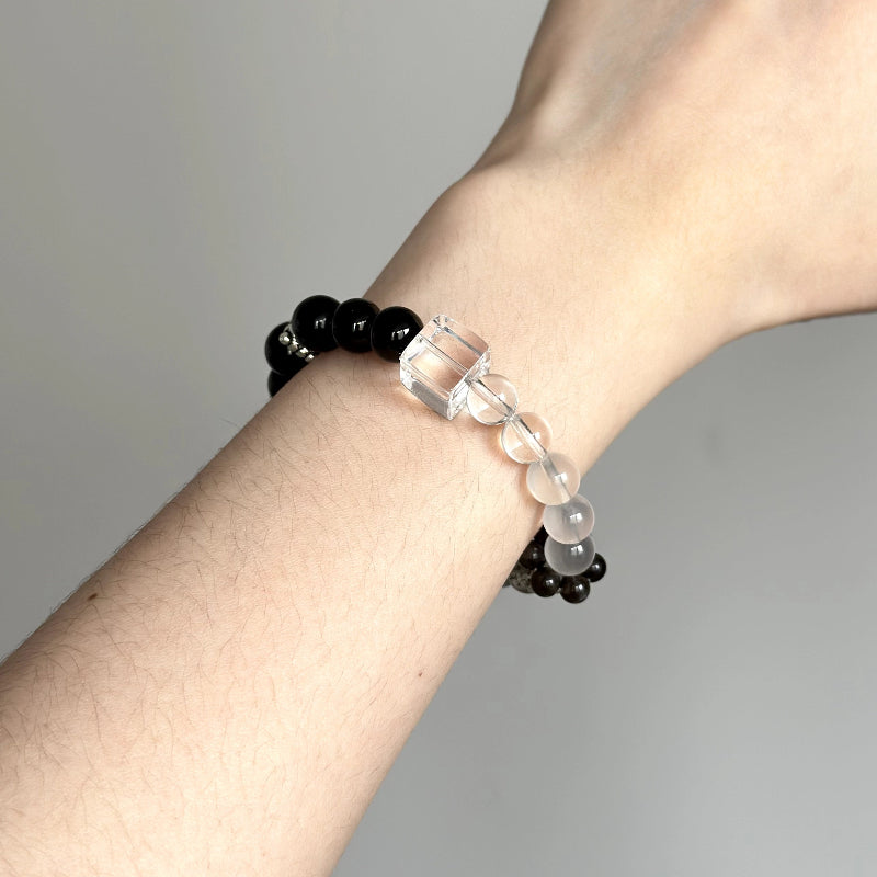 Beaded crystal bracelet made with Silver Obsidian, Grey Moonstone, and Clear Quartz – ideal for insight, strength, and energy alignment.