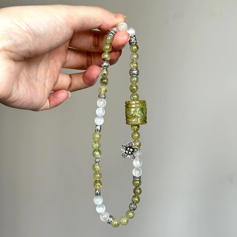 Beaded crystal bracelet with Tsavorite, Blue Moonstone, and carved Green Jade – ideal for grounding, growth, and self-love.
