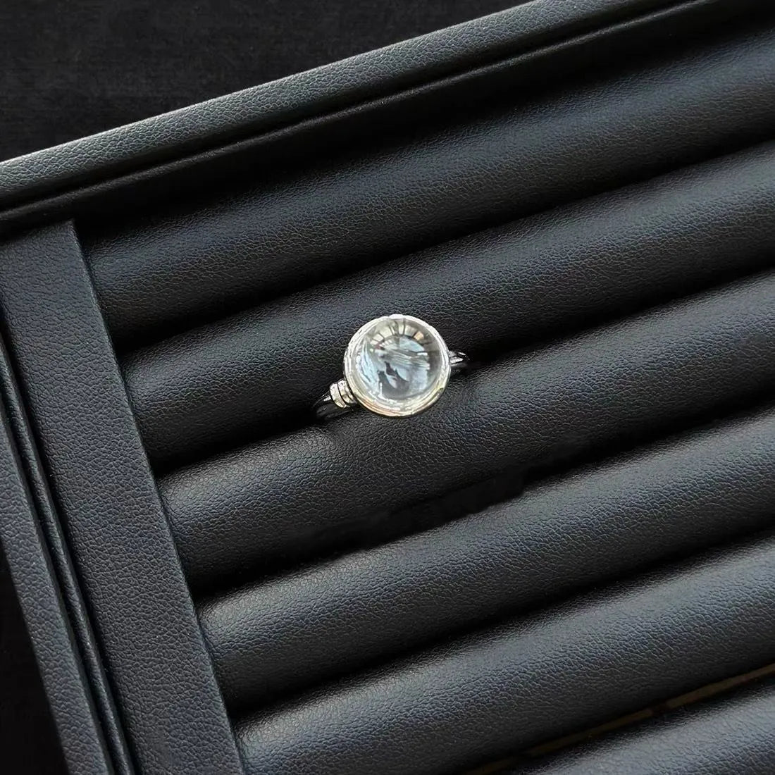 Lemurian Quartz Sterling Silver Ring on a black textured surface