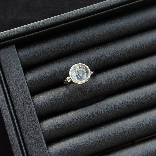 Lemurian Quartz Sterling Silver Ring on a black textured surface