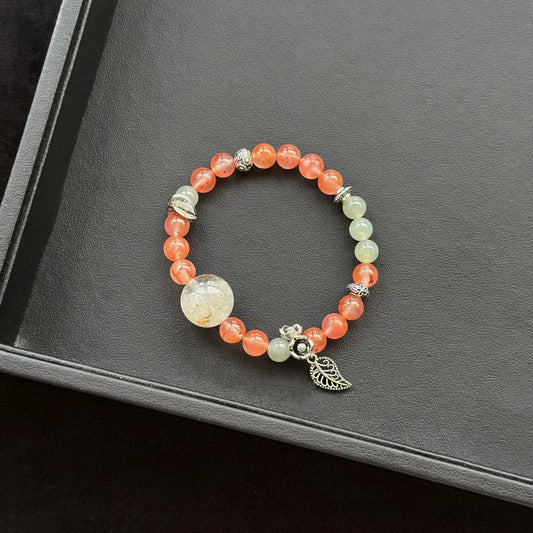 Rabbit Hair Quartz with Phantom Quartz & Ice Floating South Red Agate & Jasper Bracelet on a dark surface