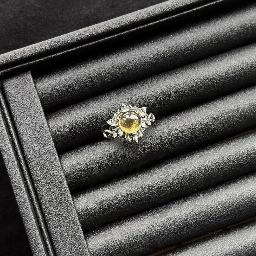 Vintage Citrine Sterling Silver Ring on a black leather surface