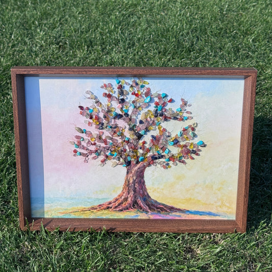 A4 Tree of Life natural crystal wall art in a dark wood frame displayed outdoors.