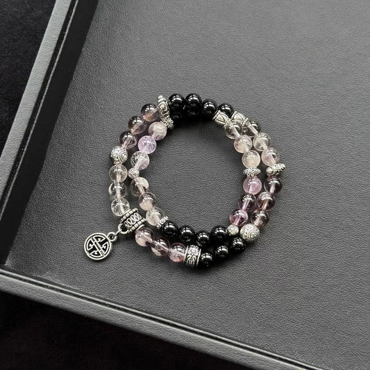 Healing crystal bracelet featuring Amethyst Phantom and Black Agate – supports intuition, emotional balance, and spiritual grounding.