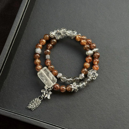 Healing crystal bracelet featuring Black Rutilated Quartz, Copper Rutilated Quartz, and Herkimer Diamond – for energy protection and clarity.