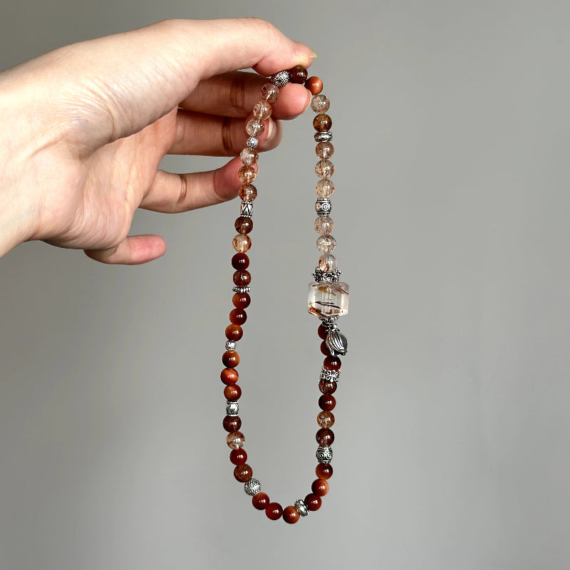 Beaded bracelet made with Black-Gold Super Seven and Copper Rutilated Quartz – ideal for personal growth, clarity, and motivation.