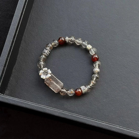 Healing crystal bracelet featuring Black Mica Hematoid Quartz, Strawberry Quartz, and Garnet – supports emotional strength, grounding, and love energy.