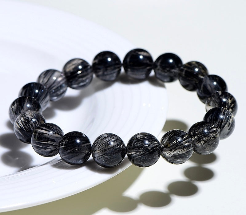 Black Rutilated Quartz Bracelet for transformation and energy alignment, by Aura Verse.