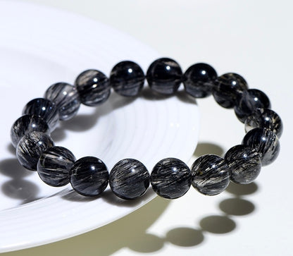 Black Rutilated Quartz Bracelet for transformation and energy alignment, by Aura Verse.