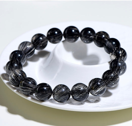 Handmade black rutilated quartz bracelet from Aura Verse, perfect for daily wear and energy rituals.
