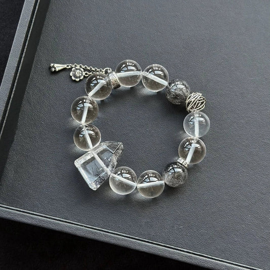 Healing crystal bracelet featuring Black Rutilated Quartz and Clear Quartz – supports clarity, protection, and energy purification.