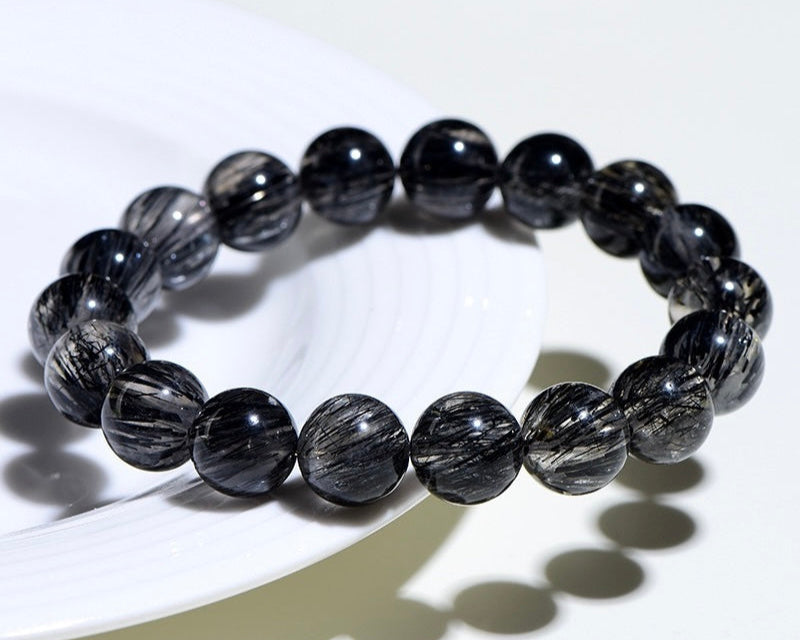 Healing crystal jewelry with Black Rutilated Quartz – perfect crystal for anxiety, depression, and energy balance