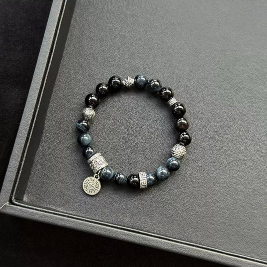 Healing crystal bracelet featuring Blue Tiger’s Eye and Black Agate – for calming energy, protection, and mental clarity.
