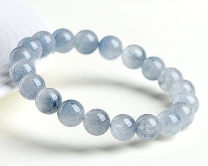 Bracelet with crystal beads – light blue rabbit hair quartz for clarity and peace