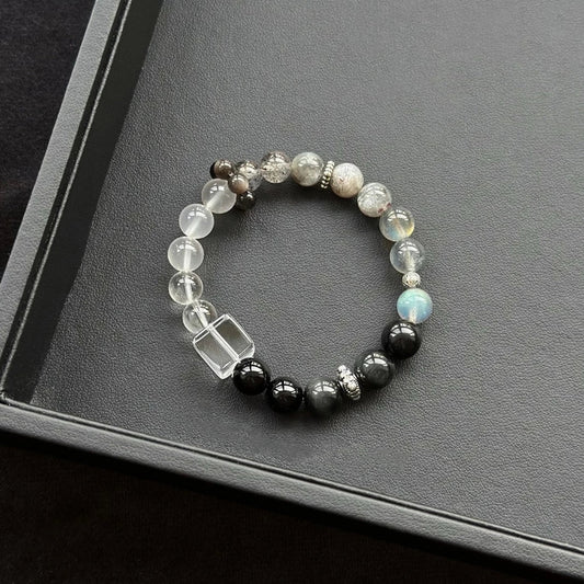 Healing crystal bracelet featuring Clear Quartz, Grey Moonstone, and Silver Obsidian – supports clarity, intuition, and energetic protection.