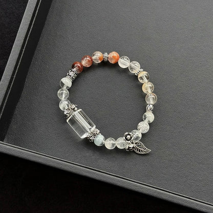 Healing crystal bracelet featuring Clear Quartz and Rabbit Hair Quartz – supports clarity, emotional healing, and gentle energy flow.