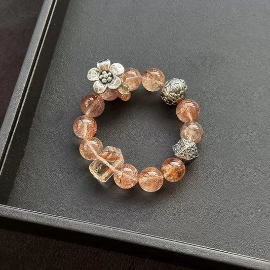 Healing crystal bracelet featuring Copper Rutilated Quartz and Arusha – supports manifestation, energy flow, and clarity.