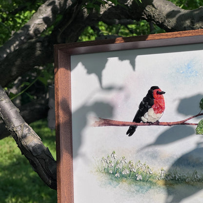 Close-up of handmade crystal bird art showing intricate gemstone mosaic texture.