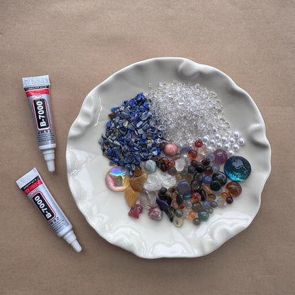 Close-up of a variety of natural healing stones and crystal chips ready for the galaxy DIY project.