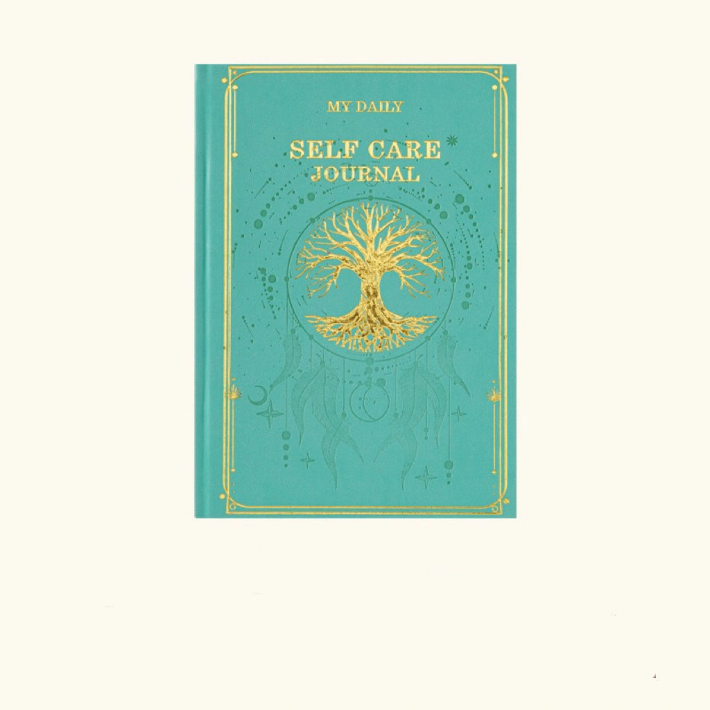 A deep emerald green aesthetic notebook decorated with traditional gold-tooled borders for meditation note-taking.