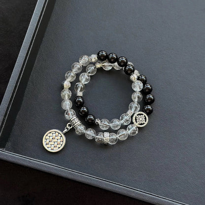 Healing crystal bracelet featuring Frost Rutilated Quartz and Black Agate – supports grounding, protection, and emotional strength.