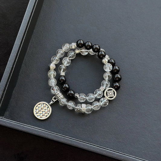 Healing crystal bracelet featuring Frost Rutilated Quartz and Black Agate – supports grounding, protection, and emotional strength.