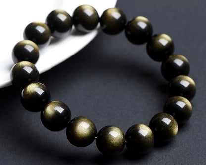 Gold Obsidian crystal bracelet promoting grounding, calm, and protection