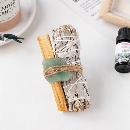 Green aventurine raw healing crystal tied onto a white sage stick, perfect for manifestation gifts and positive energy decor.