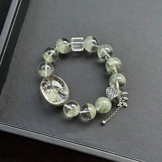 Healing crystal bracelet featuring Green Garden Phantom and Clear Quartz – supports grounding, clarity, and heart chakra energy.