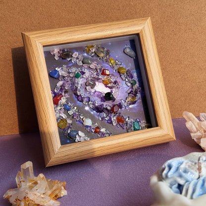Handmade healing crystal art wall decor and premium gemstone home accessories displayed on a purple aesthetic desk.