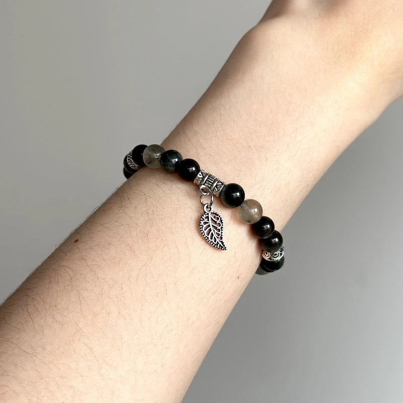 Energy crystal bracelet with Hawk’s Eye and Green Rutilated Quartz – designed for grounding, awareness, and emotional clarity.